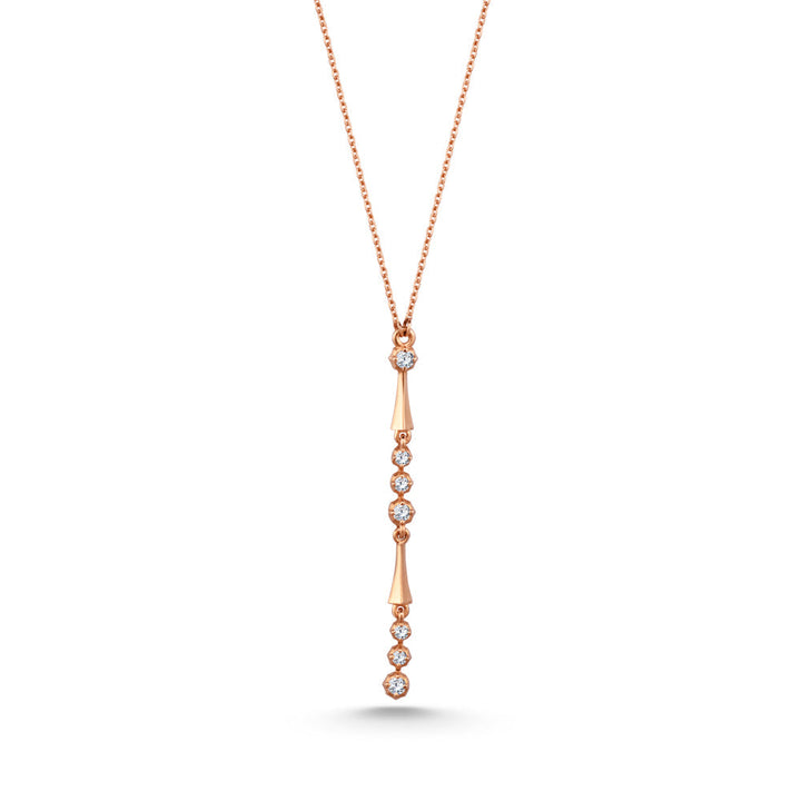 An 18K rose gold diamond necklace with a series of round diamonds set along the length of the necklace.